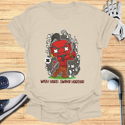 Cartoon devil swings a golf club with "WISH HARD. SWING HARDER." text.
