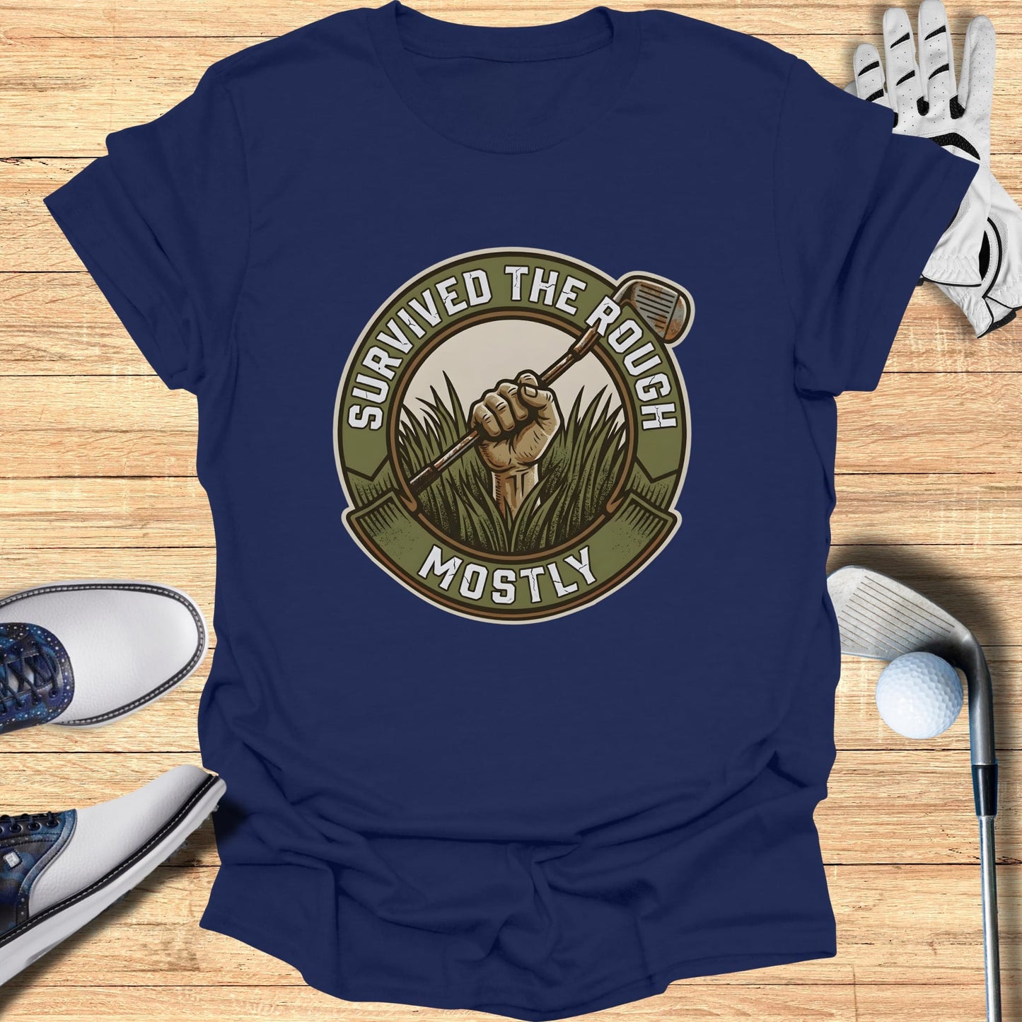 Navy t-shirt with circular "Survived the Rough Mostly" golf graphic.