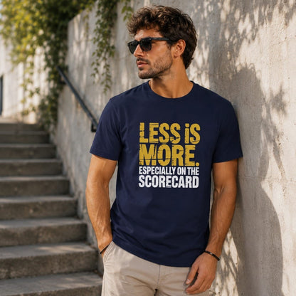 Navy t-shirt with yellow text reading "LESS IS MORE. ESPECIALLY ON THE SCORECARD."