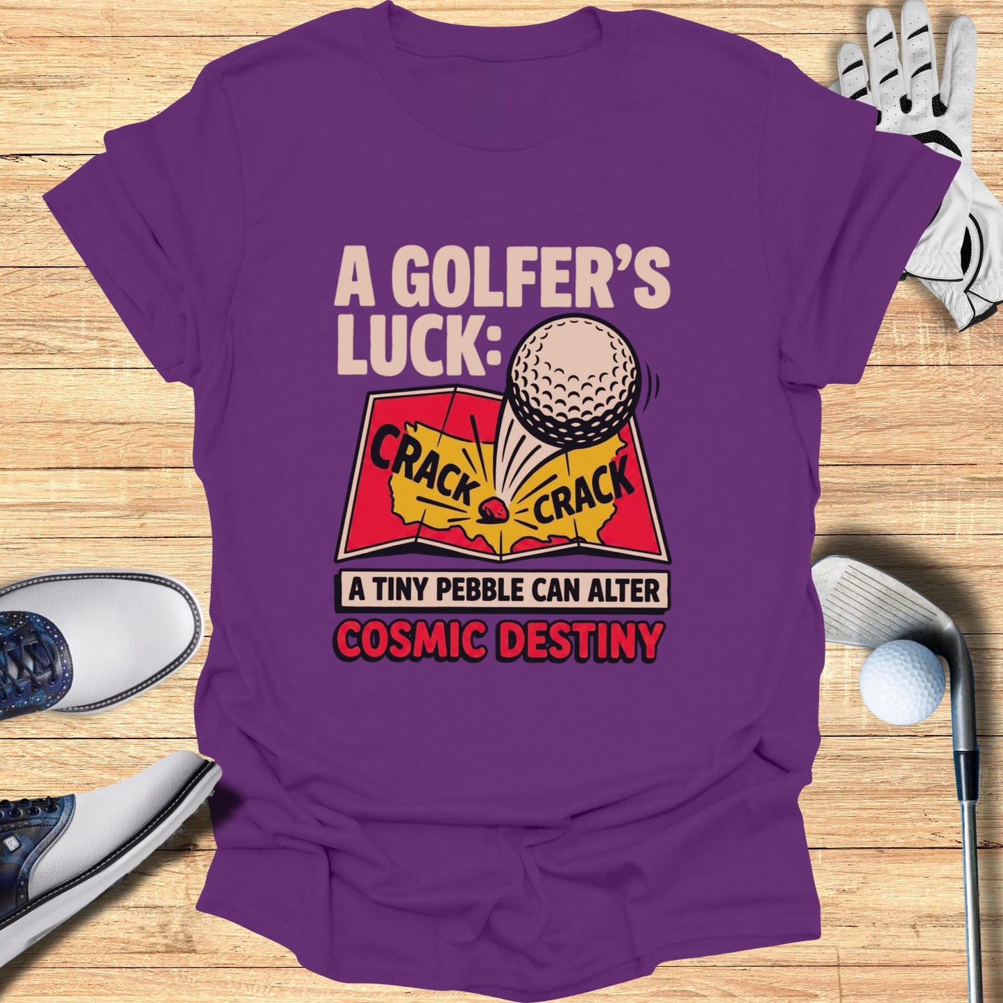 Purple t-shirt with "A Golfer's Luck: A tiny pebble can alter cosmic destiny" graphic.