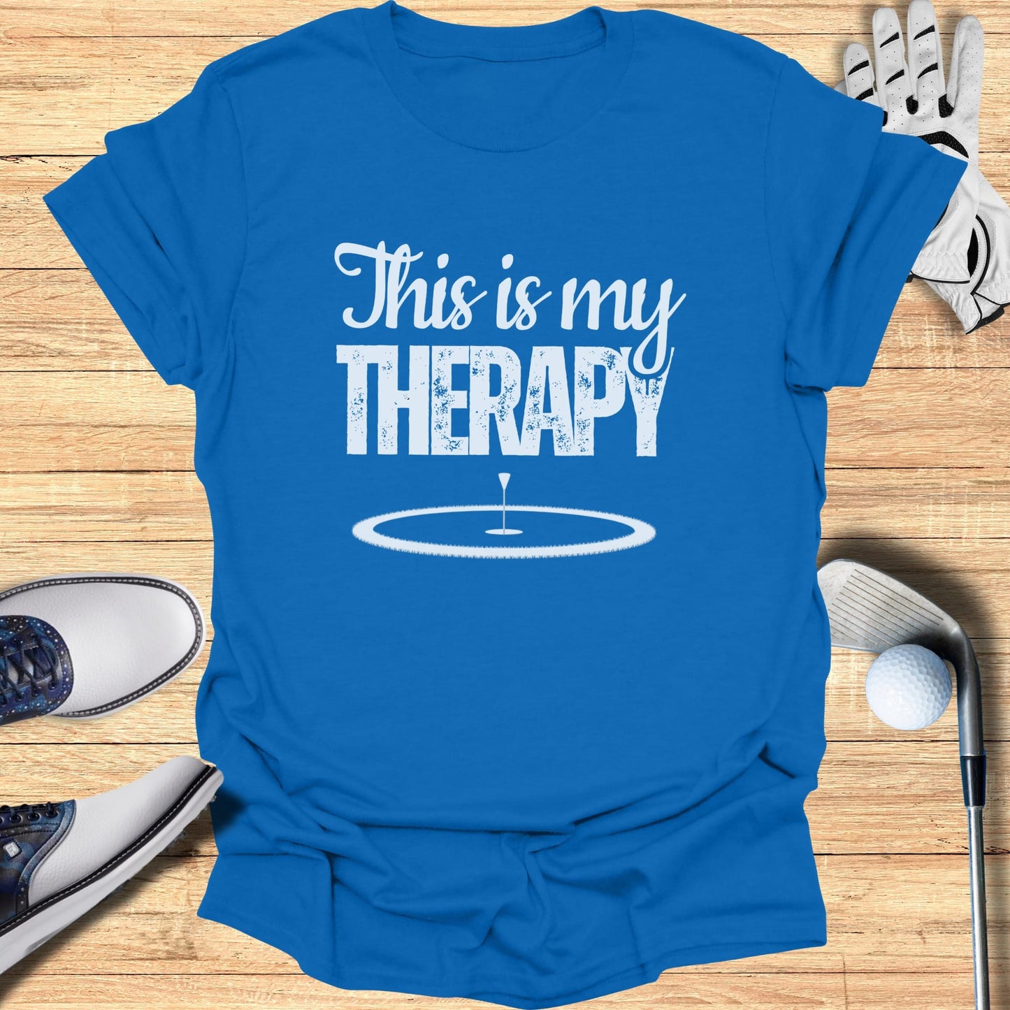 Blue t-shirt with "This is my therapy" and a golf hole graphic.