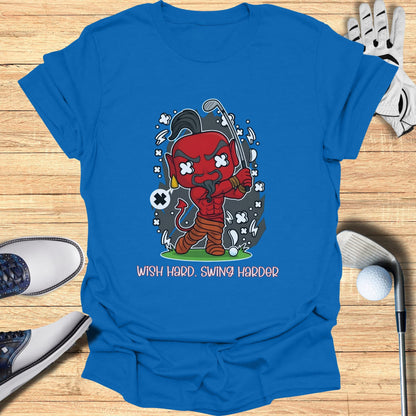 Cartoon devil swinging golf club on a blue t-shirt with text.