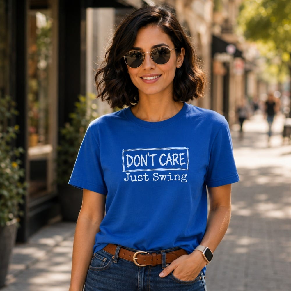 Woman wearing a royal blue t-shirt with white text "Don't Care Just Swing".