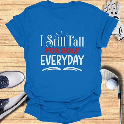 Blue t-shirt with "I Still Fall For GOLF EVERYDAY" text.